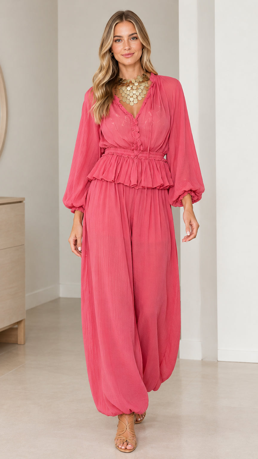 Front view of model wearing Rose Pink smocked peplum top and harem pants set