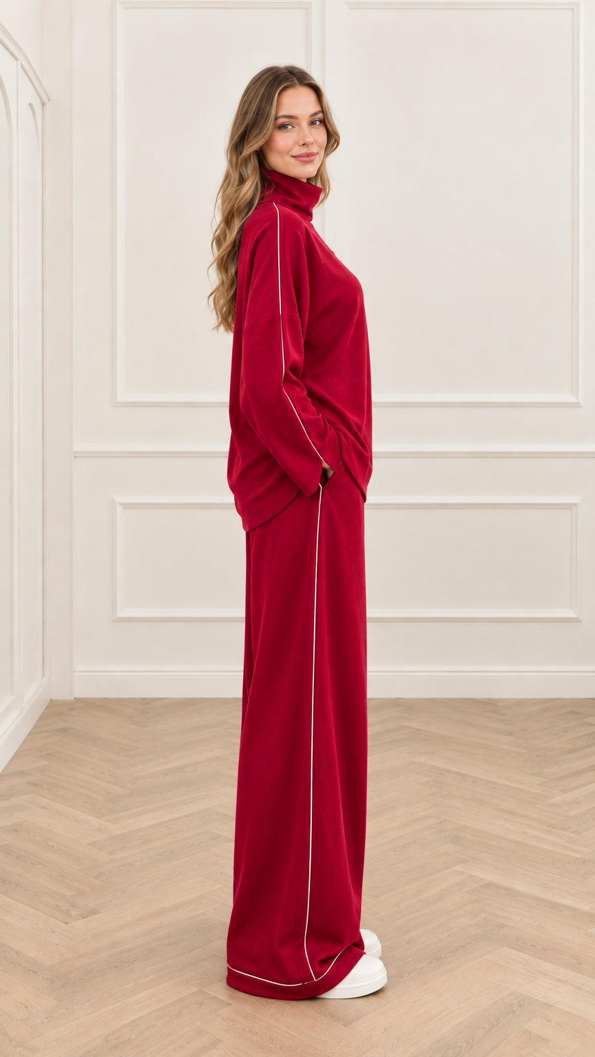 Side view of red two-piece mock neck loungewear set showing white side stripe