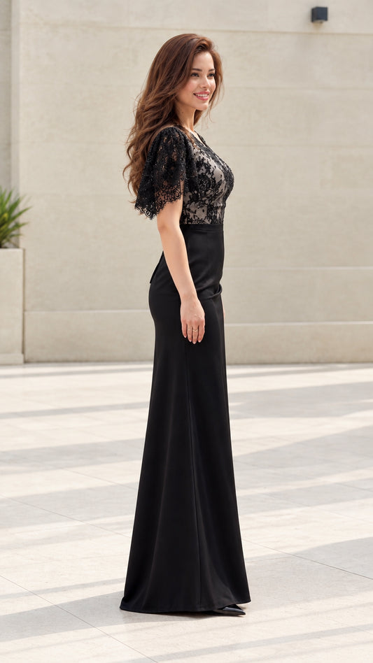 Side view of model showing the silhouette of black lace maxi dress