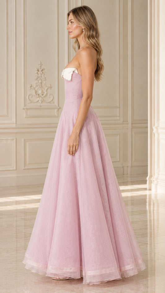 Side profile of model wearing Blush Pink strapless A-line evening maxi gown