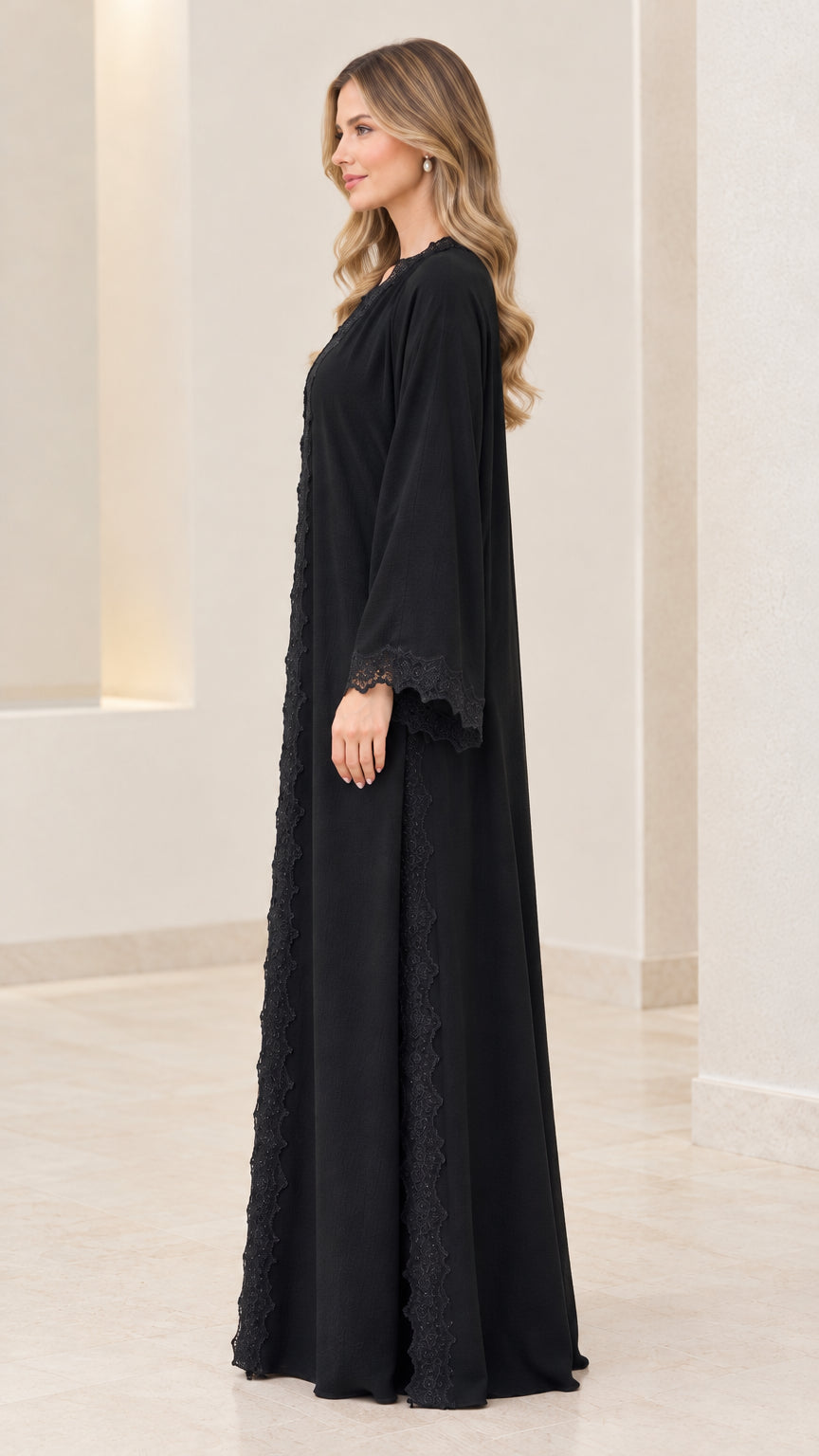 Side profile view of women's black long sleeve abaya dress