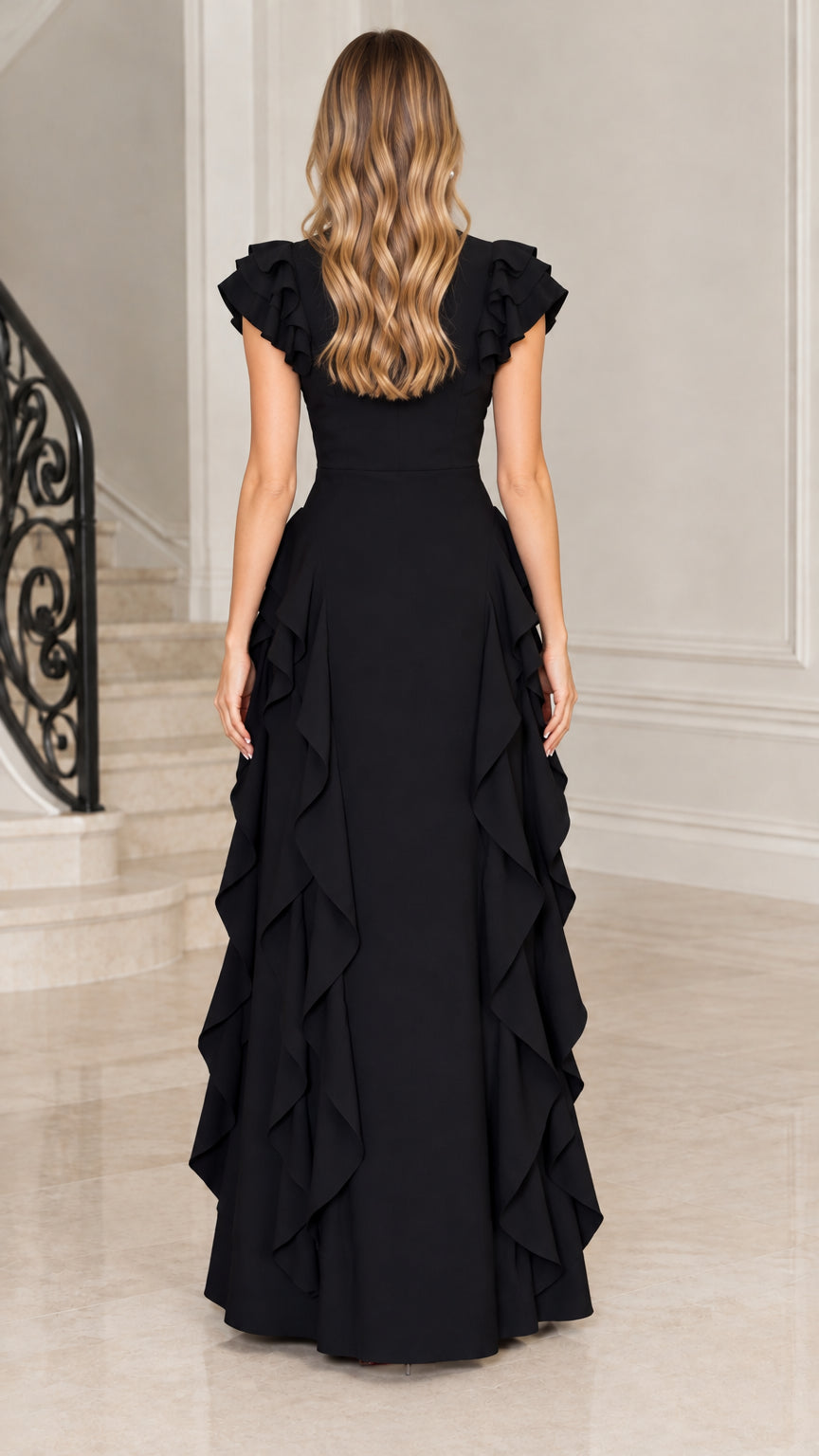 Back view of model in black floor-length flutter sleeve maxi dress