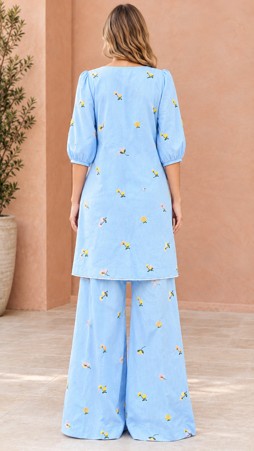 Back view of sky blue two-piece embroidered tunic and palazzo pants
