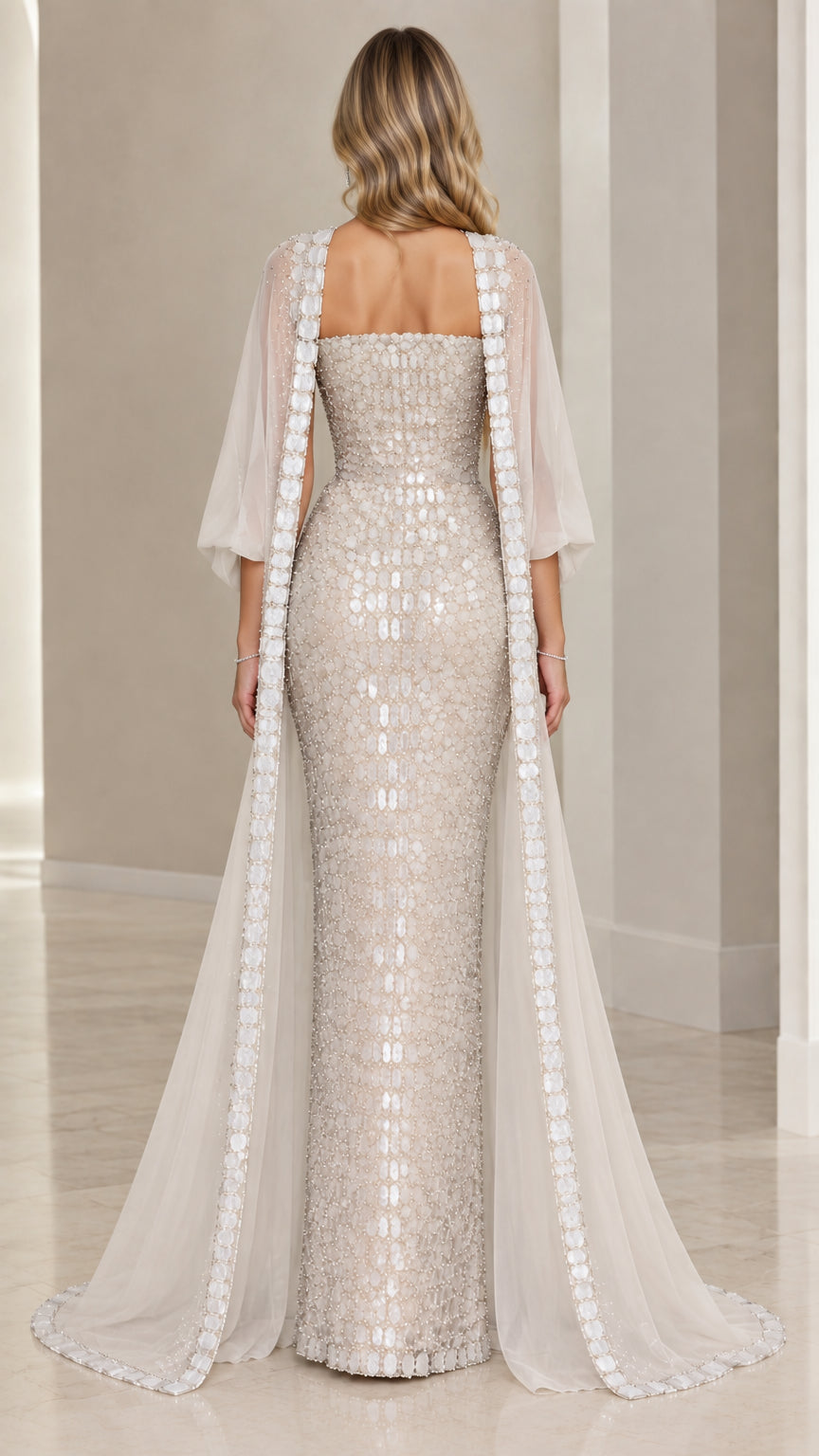 Back view of strapless sequin column dress with floor-length sheer cape