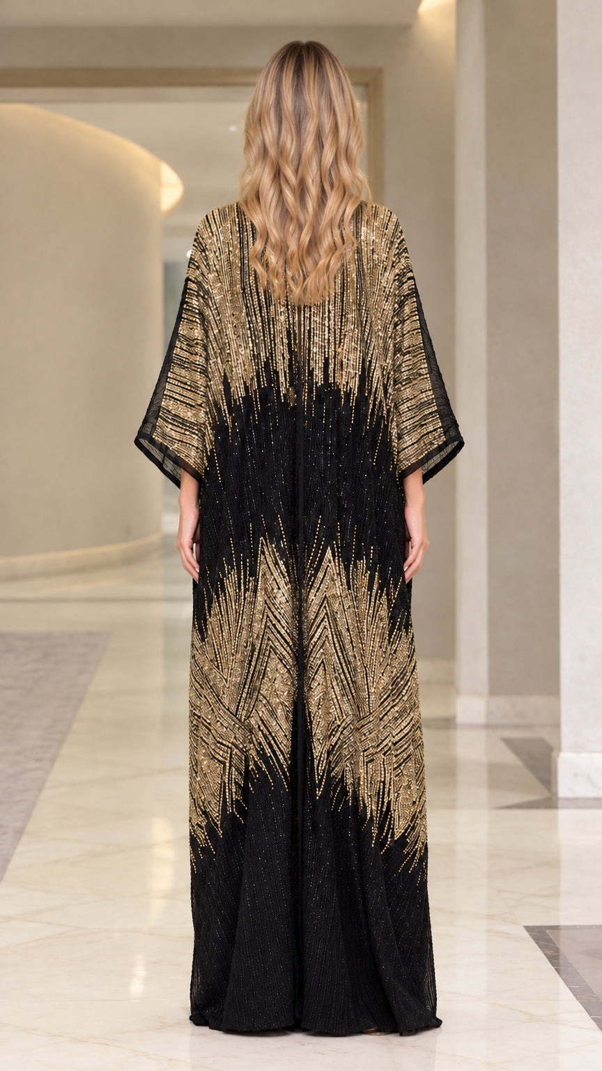 Back view of woman wearing shimmering black and gold floor-length kaftan dress