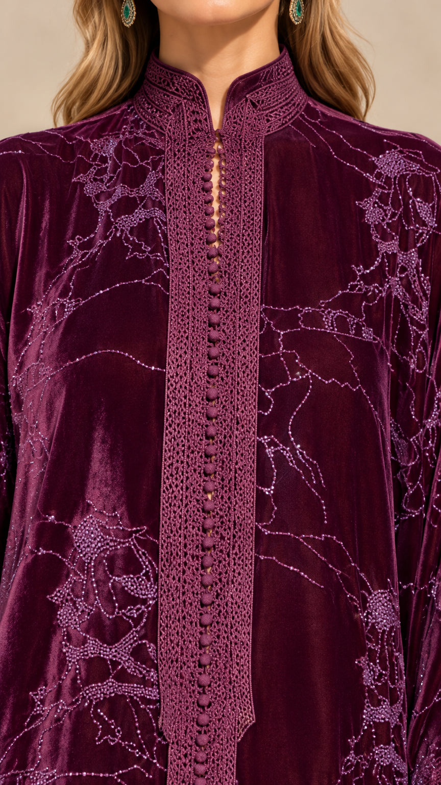 Close-up detail of mandarin collar and braided button placket on plum velvet dress