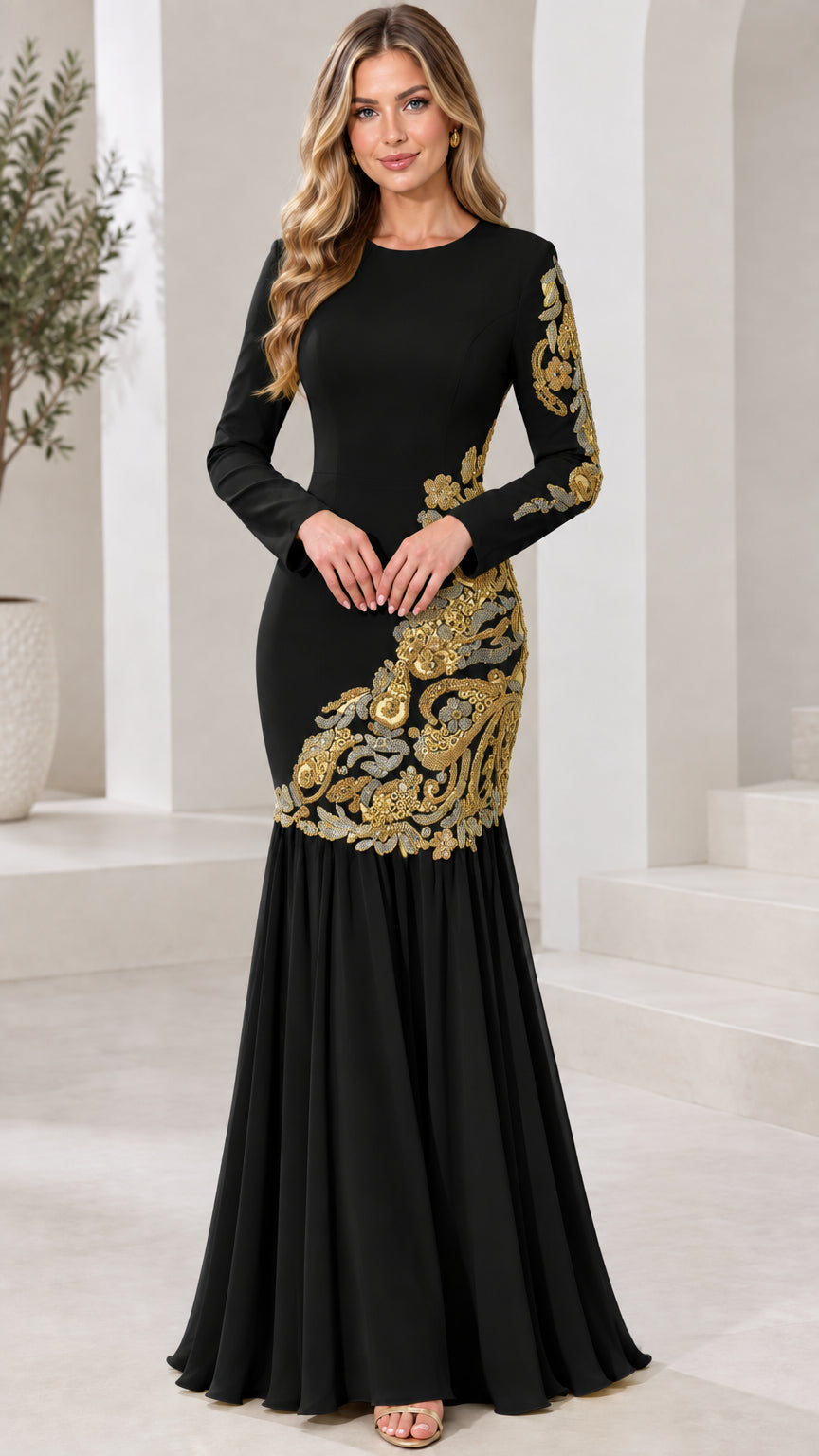 Model wearing black long sleeve formal mermaid dress with gold appliqué