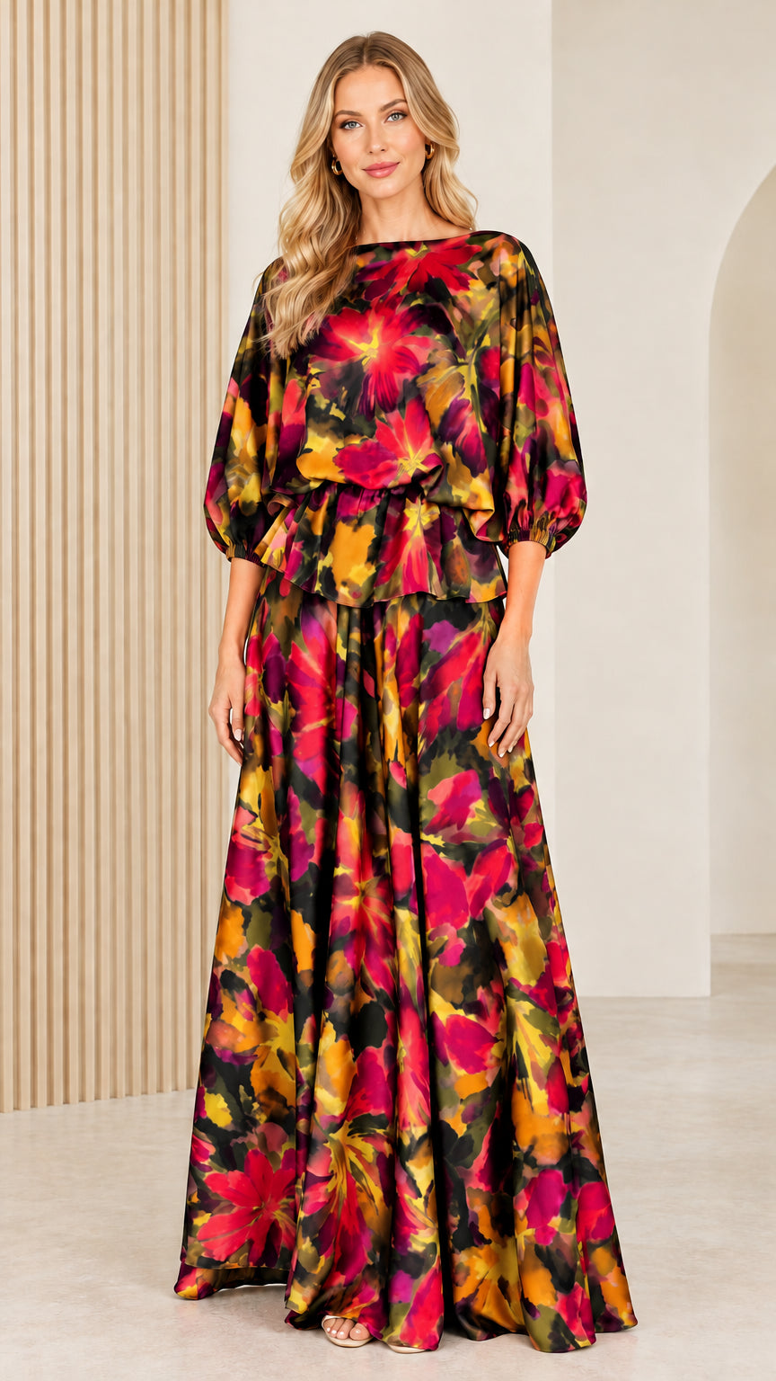 Front full view of woman wearing black and multicolor floral satin maxi dress