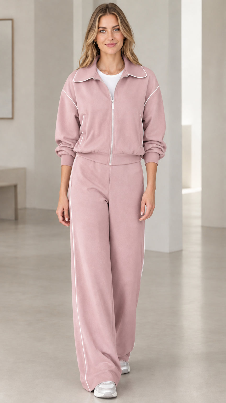 Front view of model wearing Dusty Rose pink zip-front tracksuit set with wide-leg pants