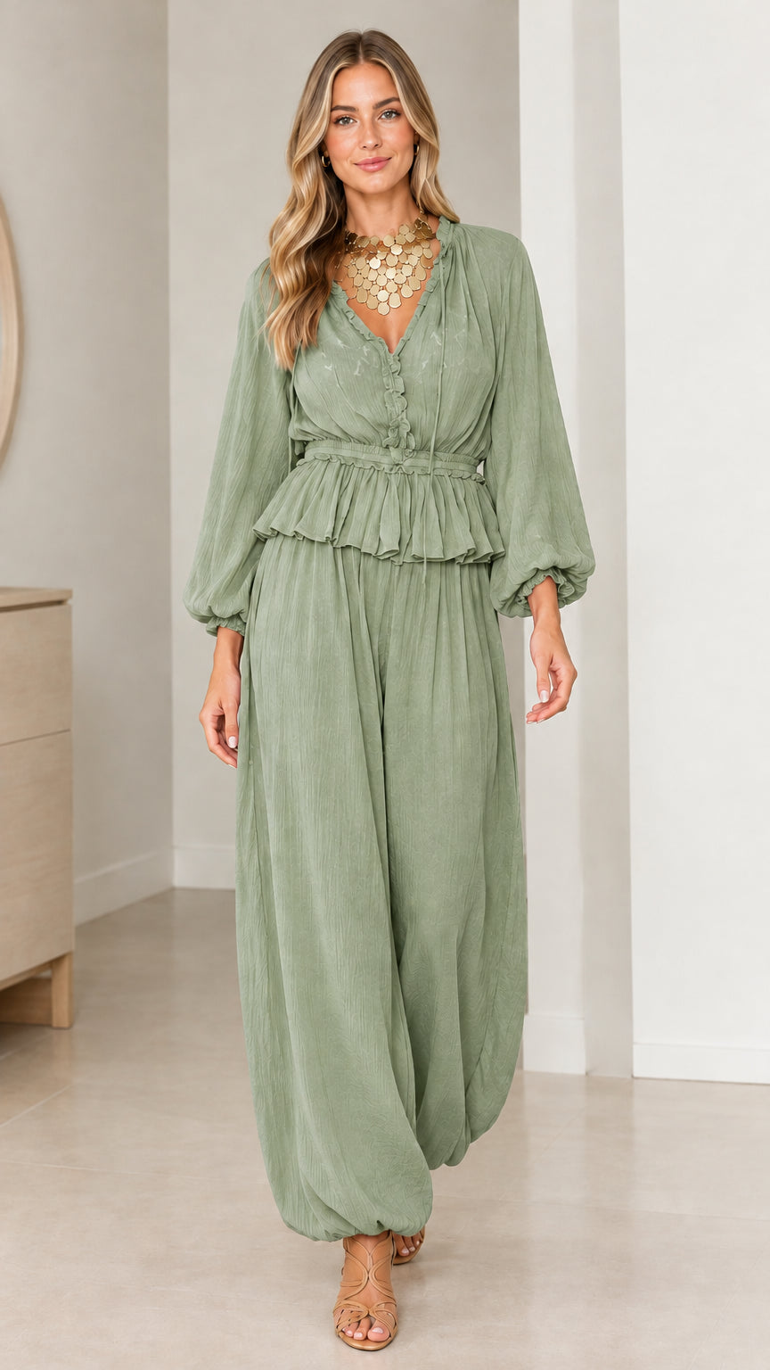 Model wearing Sage Green two-piece smocked blouse and harem pants set