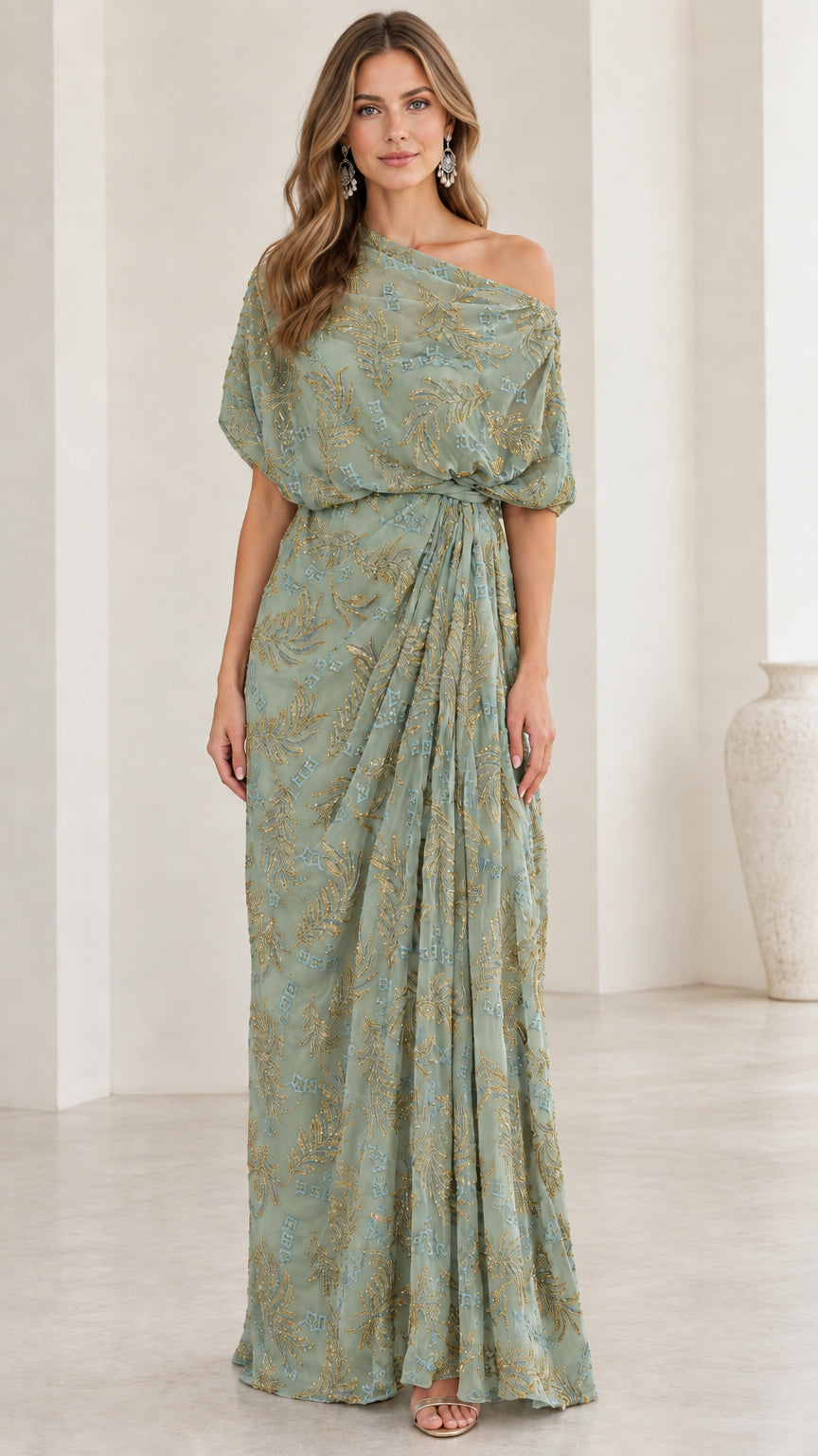 Woman wearing sage green one-shoulder embroidered draped evening dress