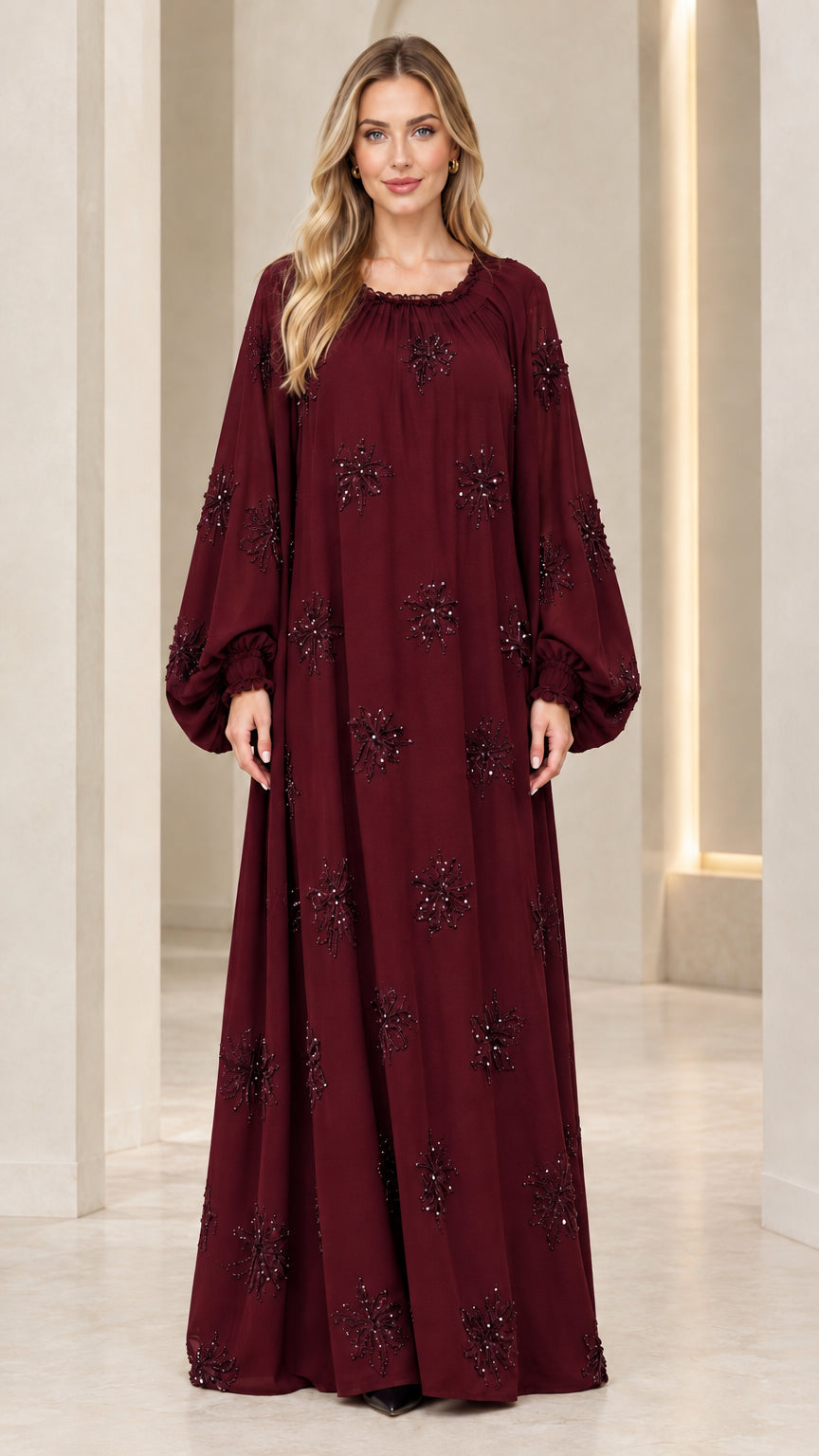 Full-length front view of model wearing burgundy wine embellished evening maxi dress
