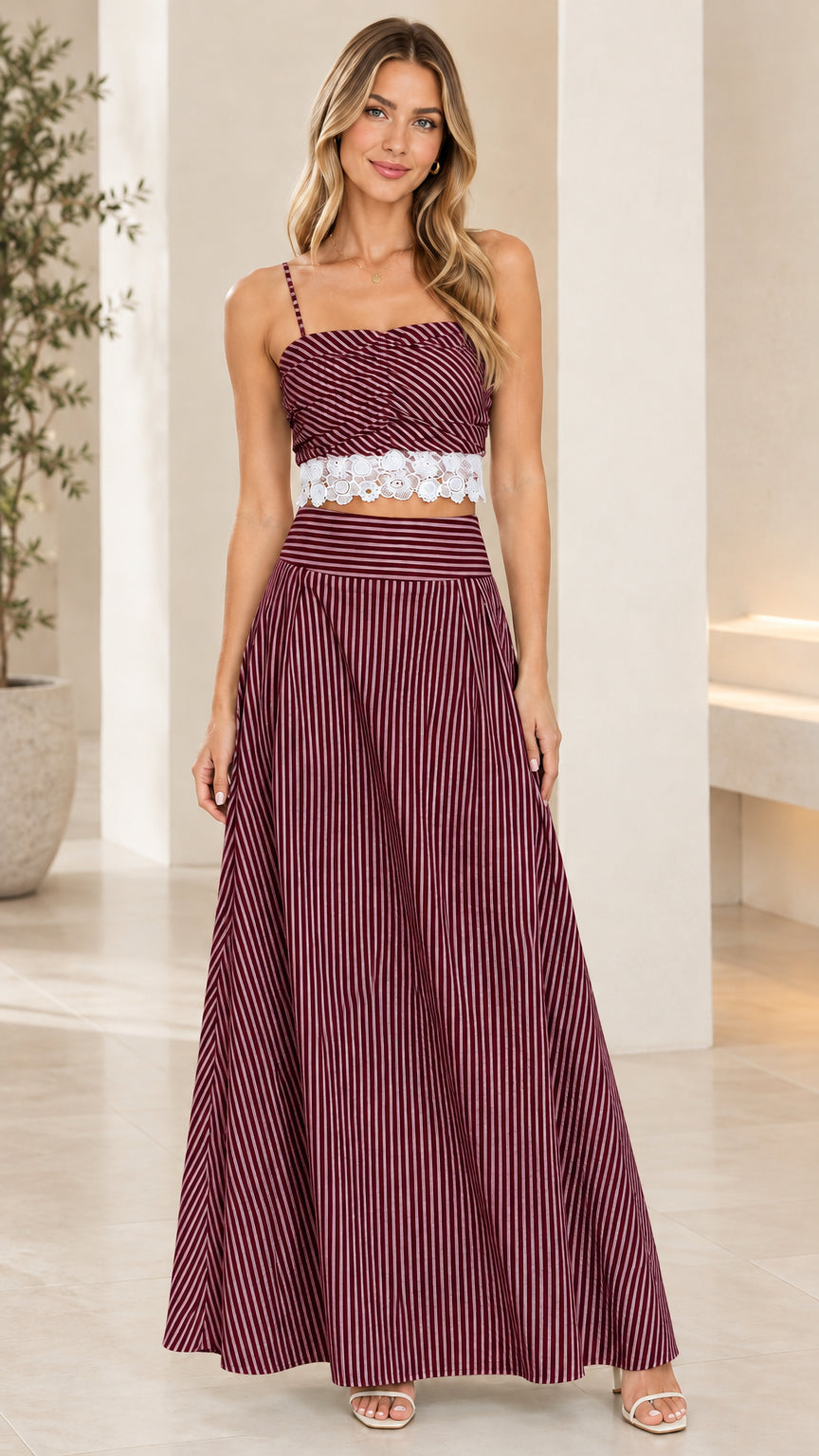 Front view of model wearing burgundy striped crop top and maxi skirt set