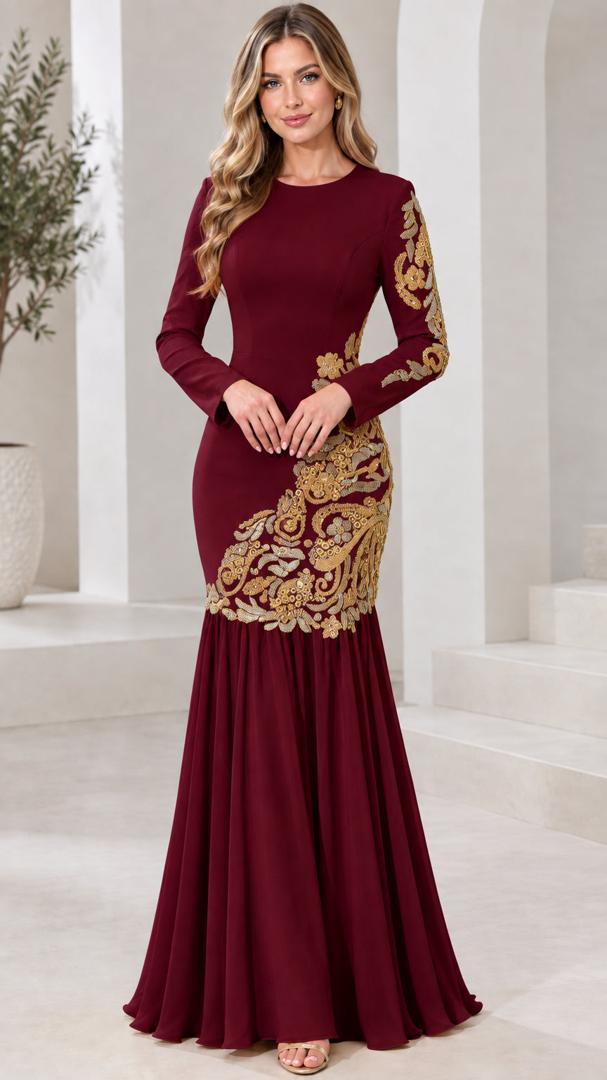 Model wearing burgundy red long sleeve formal dress with gold accents
