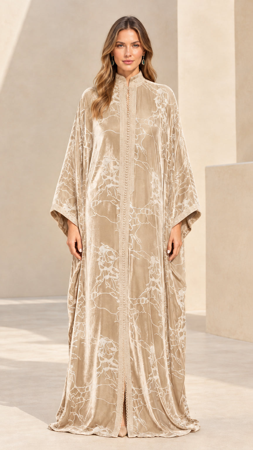 Front full-length view of champagne beige embroidered velvet maxi kaftan dress