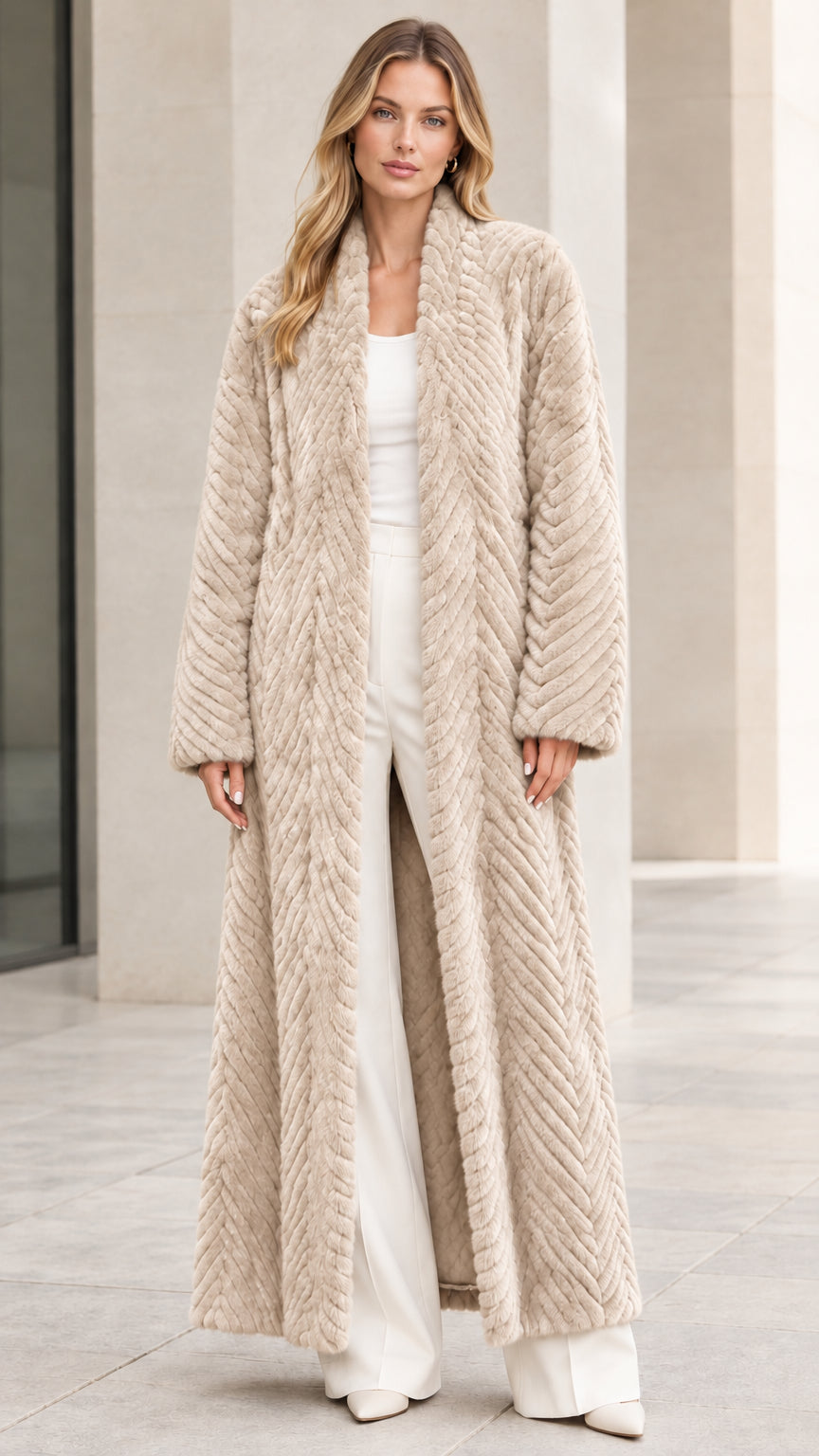 Front view of model wearing beige cream chevron textured faux fur maxi coat