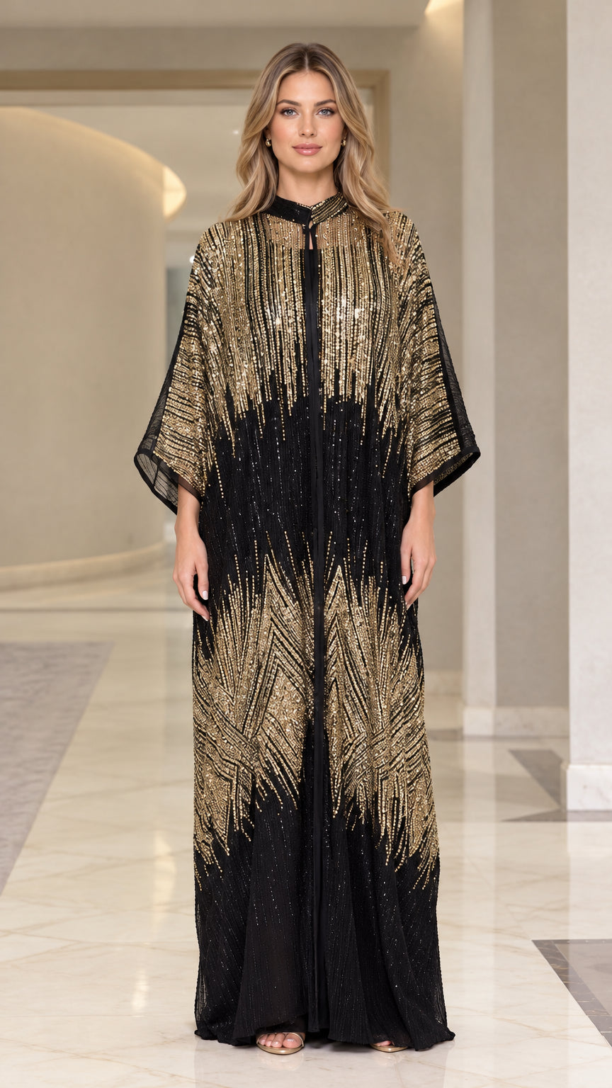 Front full-length view of woman wearing black and gold sequin kaftan maxi dress