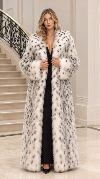 Front full view of woman wearing white spotted faux fur maxi coat over black dress