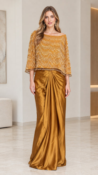 Front full-length view of the Gold beaded capelet satin evening gown