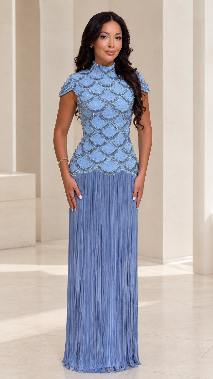 Front view of woman wearing Dusty Blue beaded scallop bodice maxi dress with fringe skirt