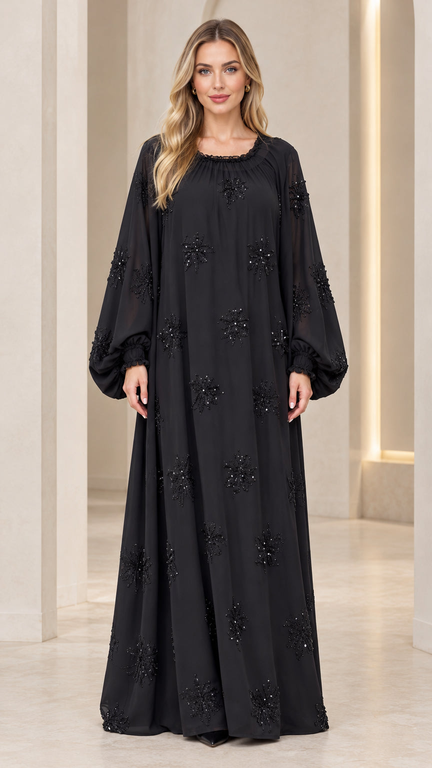 Front full-length view of model wearing black embellished balloon sleeve maxi dress