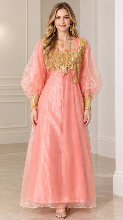 Front view of model wearing pink gold embellished lantern sleeve maxi dress