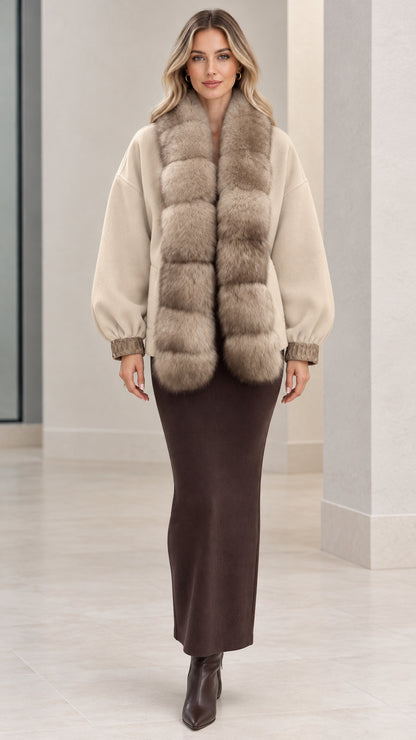 Front full view of beige faux fur trim short coat worn with brown knit dress