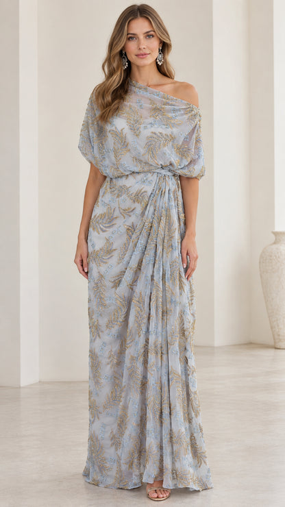 Front view of woman wearing slate blue one-shoulder embroidered draped maxi dress