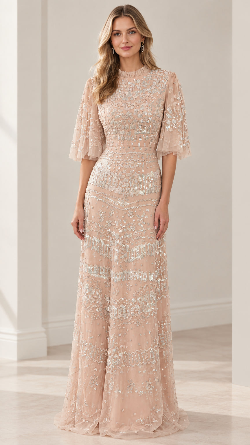 Front view of woman wearing full-length sequined flutter sleeve evening gown in champagne