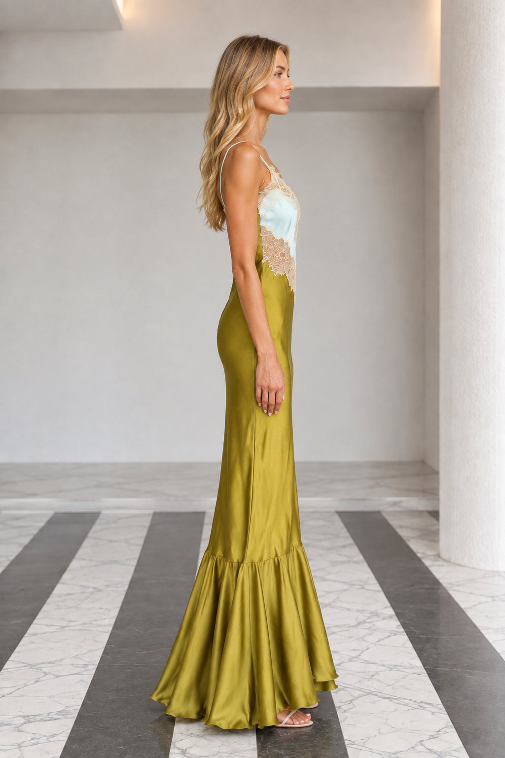 Side profile view of olive green satin maxi slip dress showing fitted silhouette