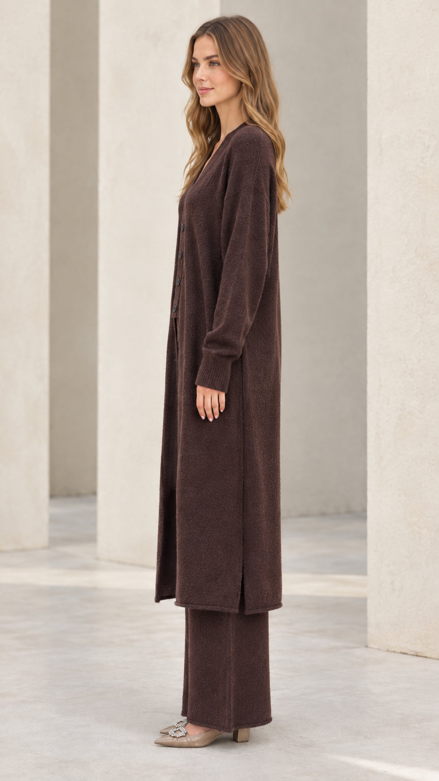 Side profile view of model wearing chocolate brown 3-piece knit loungewear set