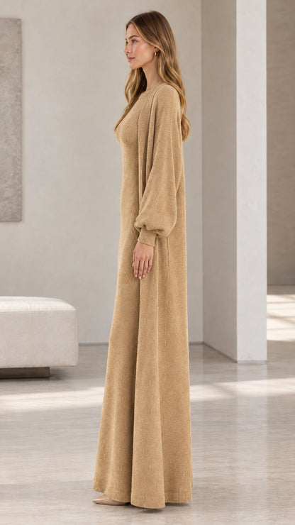 Side profile view of woman modeling camel ribbed knit dress and open duster cardigan