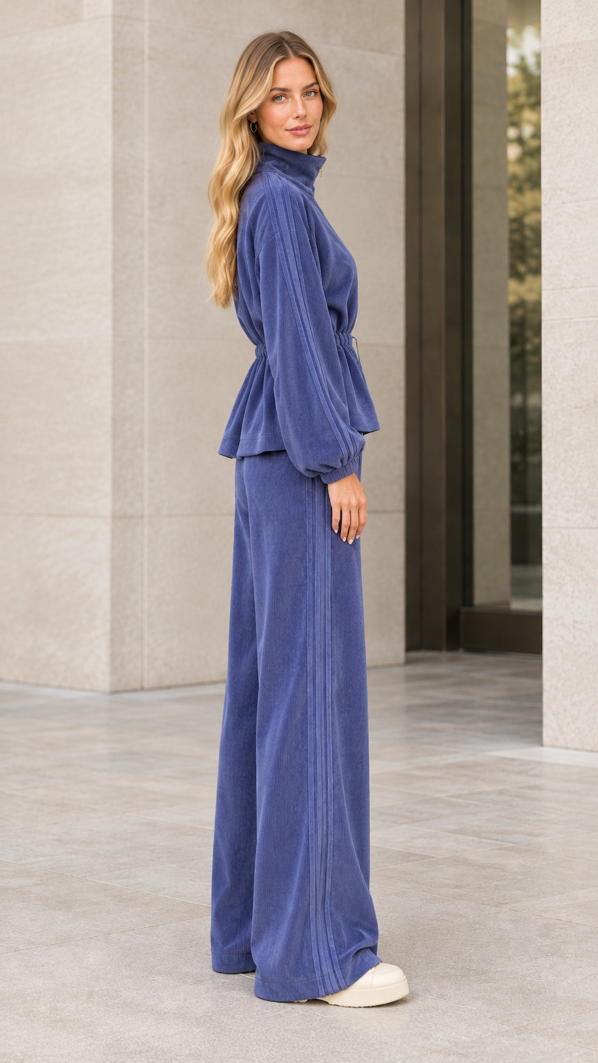 Side profile of woman in slate blue ribbed corduroy two piece lounge set