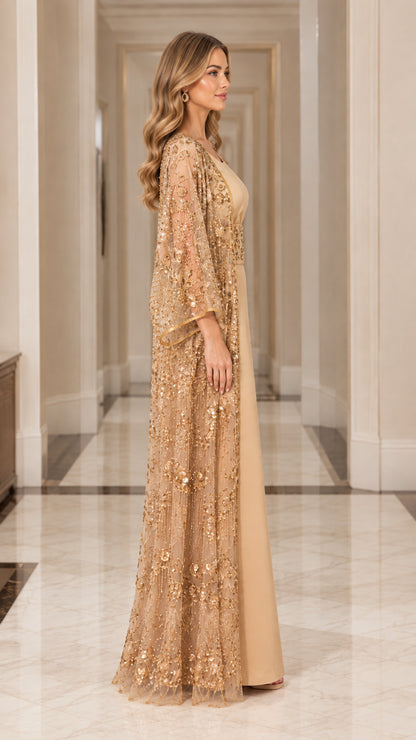 Side profile view of gold embroidered cape abaya formal evening gown