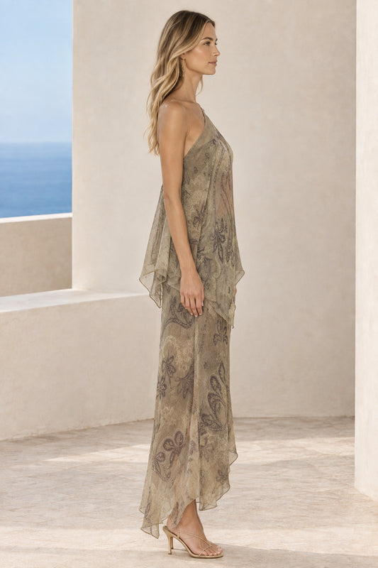 Side profile of woman in olive green one-shoulder paisley chiffon maxi dress