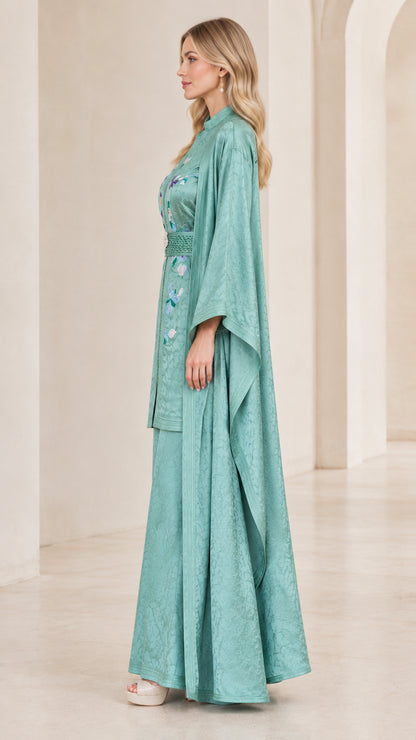 Side profile view of Sage Green modest embroidered kaftan pant suit with sweeping duster