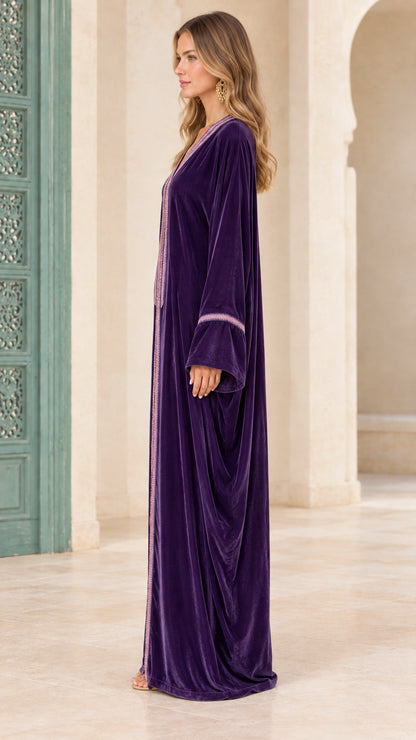 Side profile view of deep purple long velvet kaftan gown