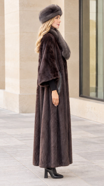 Side profile view of women's long plush faux fur coat in espresso brown