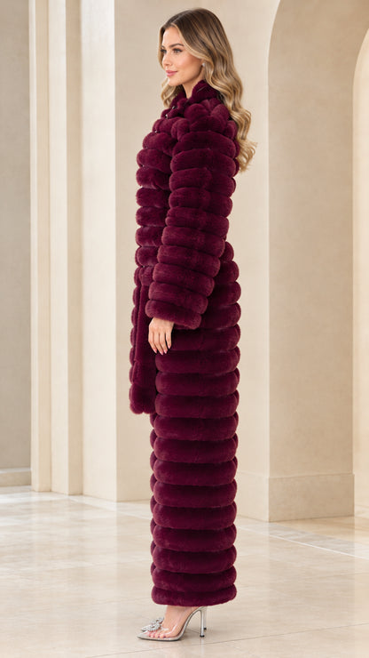 Side profile of burgundy faux fur jumpsuit showing straight leg and plush texture