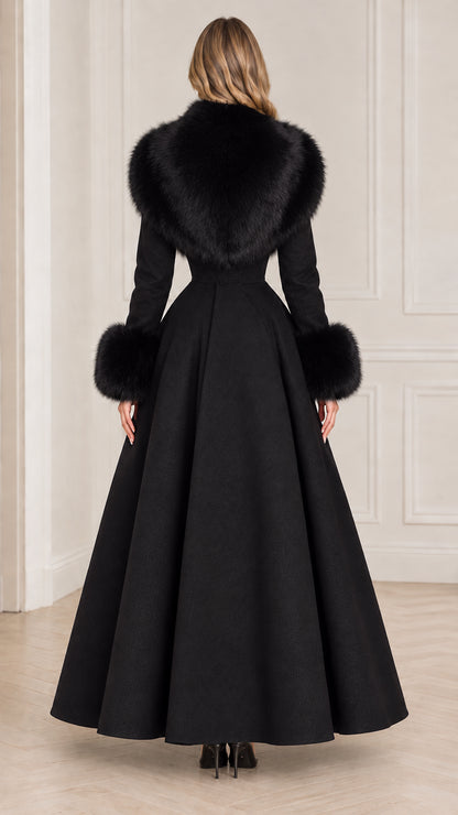 Back view of black longline maxi coat showing sweeping skirt silhouette