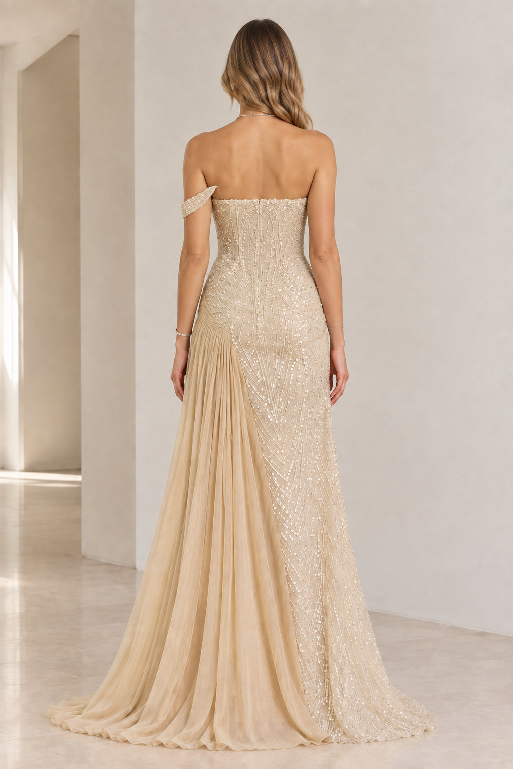 Back view of champagne sequin and pleated chiffon evening gown