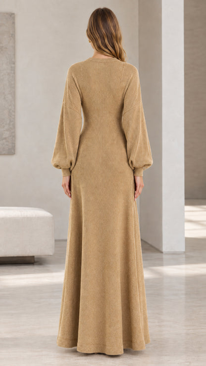Back view of woman showing fit and drape of camel knit maxi dress and long cardigan set