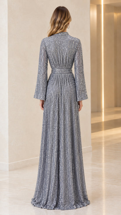 Back view of silver sequin maxi dress highlighting full-length silhouette and clean back fit
