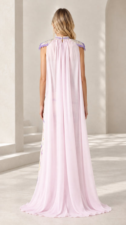Back view of floor-length light pink sheer cape cascading from collar neckline
