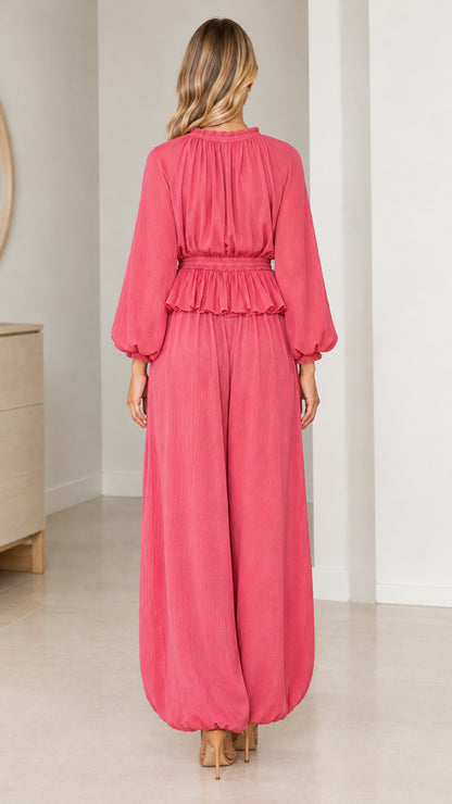 Back view of model in Rose Pink long sleeve blouse and wide leg trousers