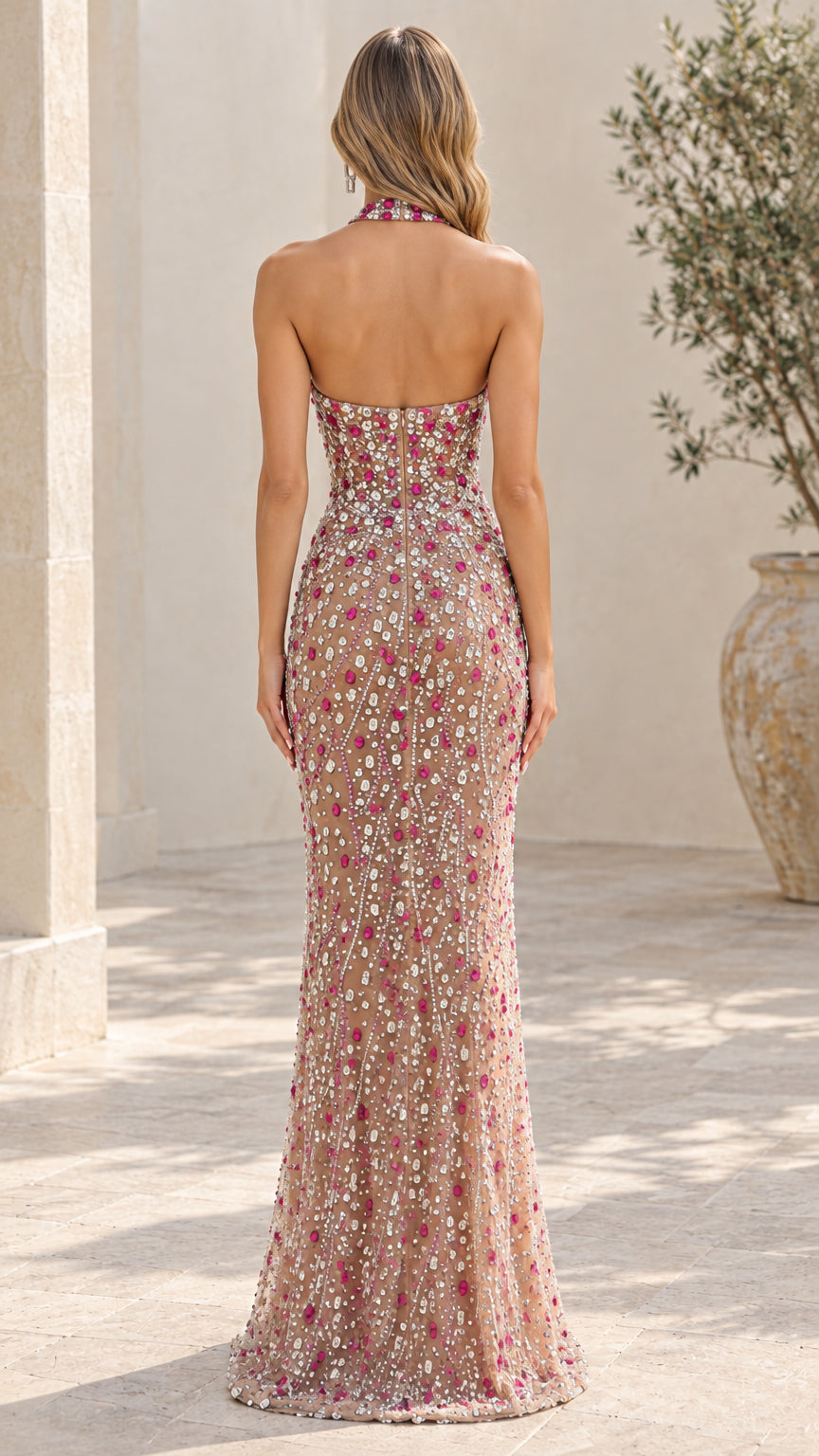 Back view of open back crystal embellished floor length evening dress