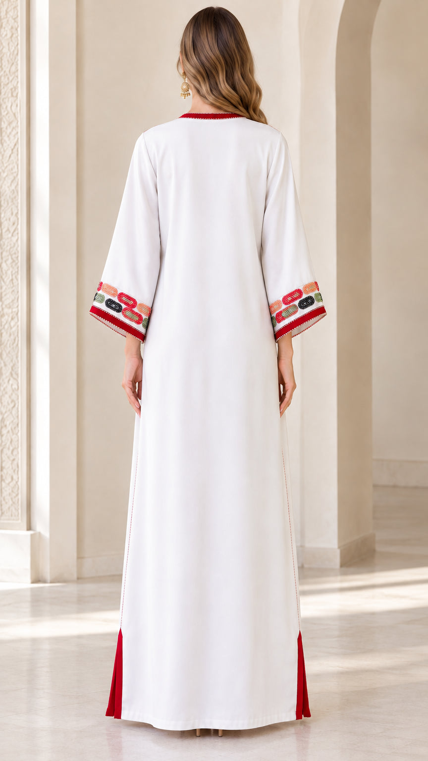 Back view of woman wearing white floor-length kaftan dress