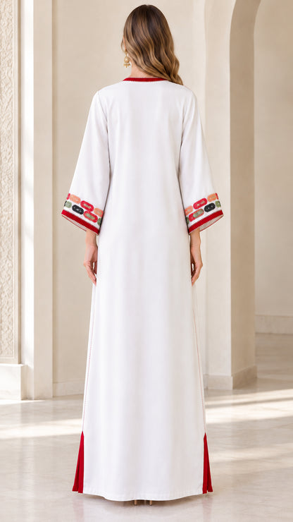 Back view of woman wearing white floor-length kaftan dress
