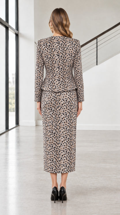 Back view of model wearing taupe two-piece tailored skirt suit set