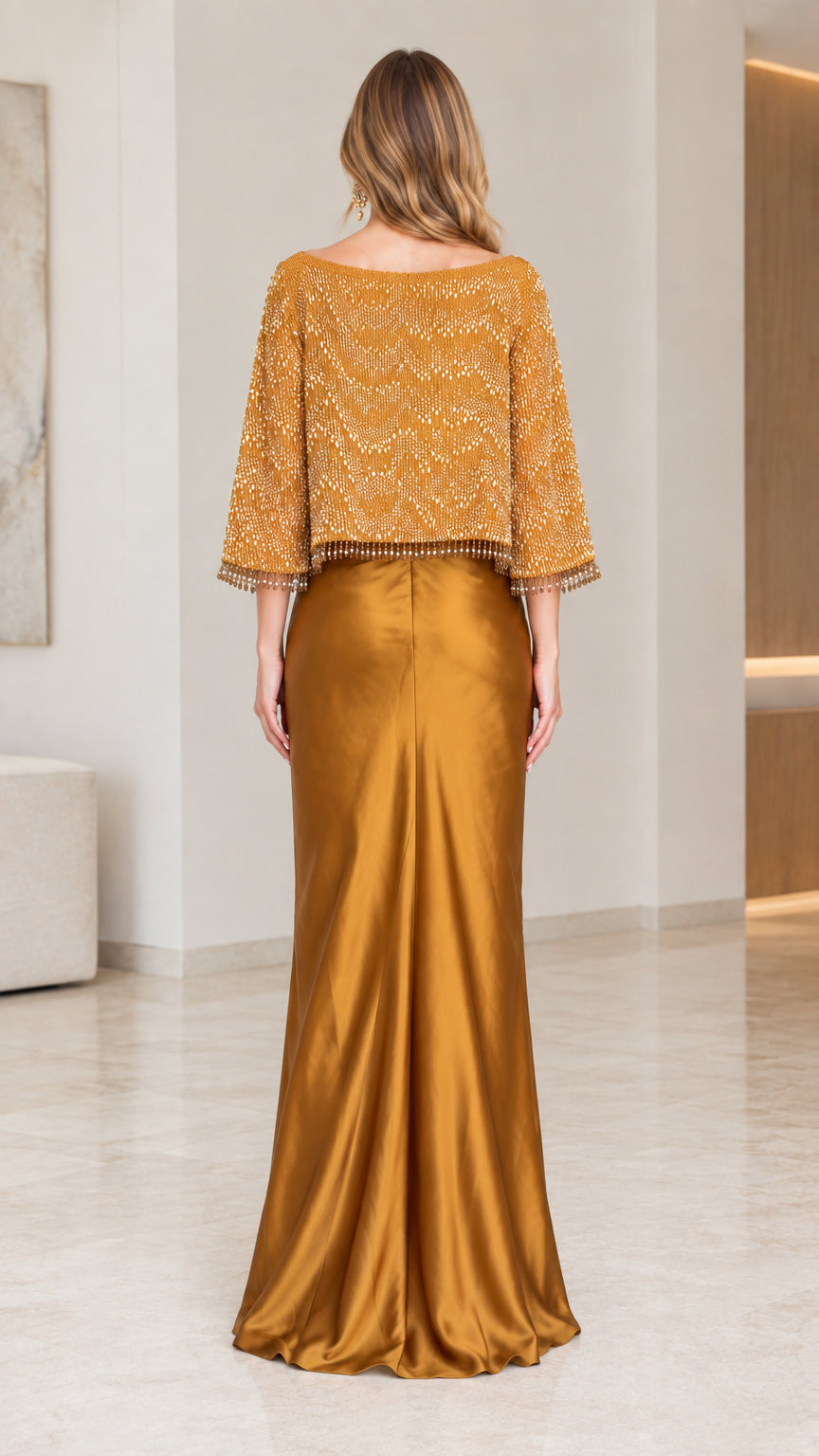 Back full-length view of the Gold satin formal gown with capelet